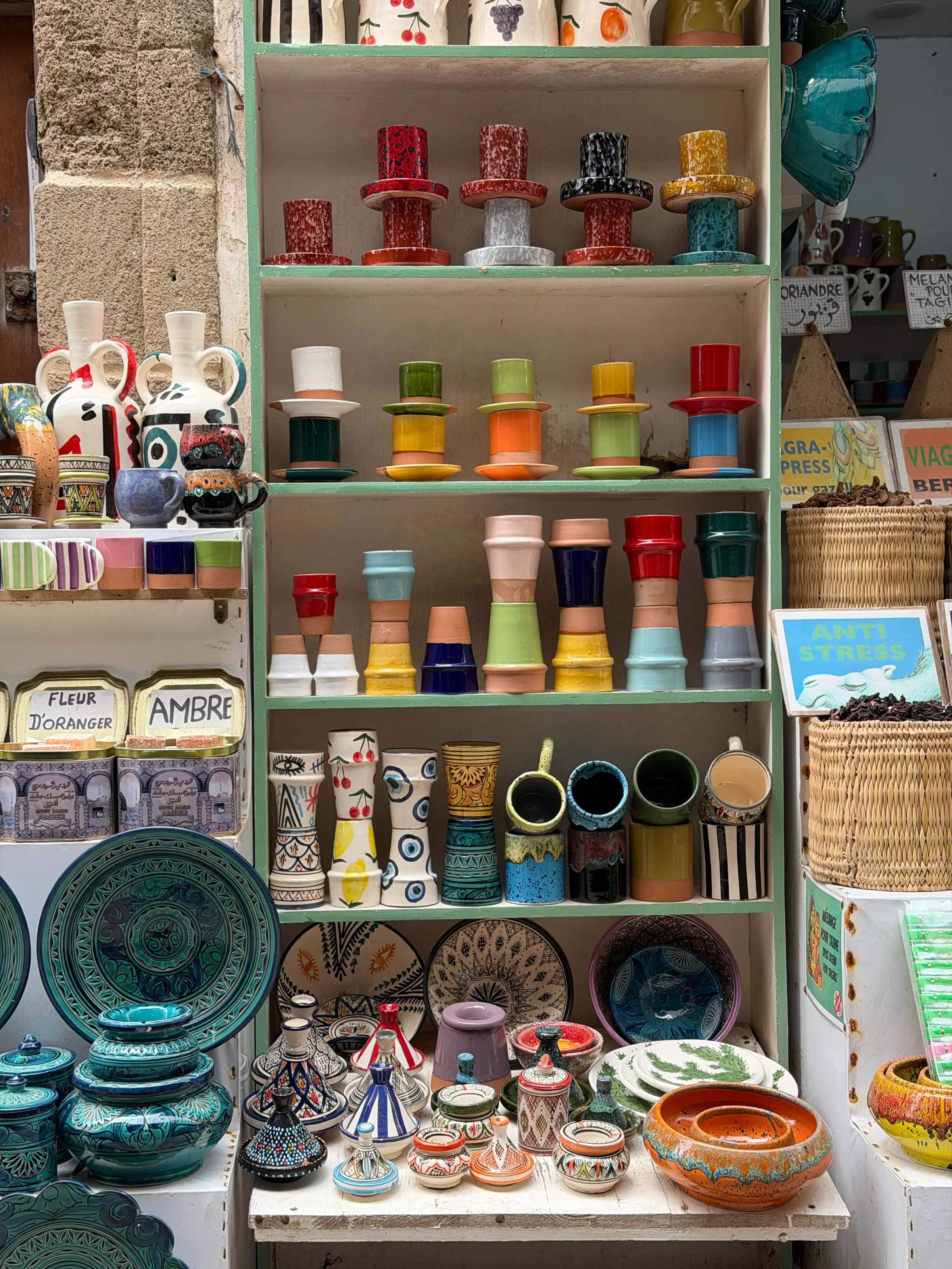 Shelves of Moroccan pottery in a market stall